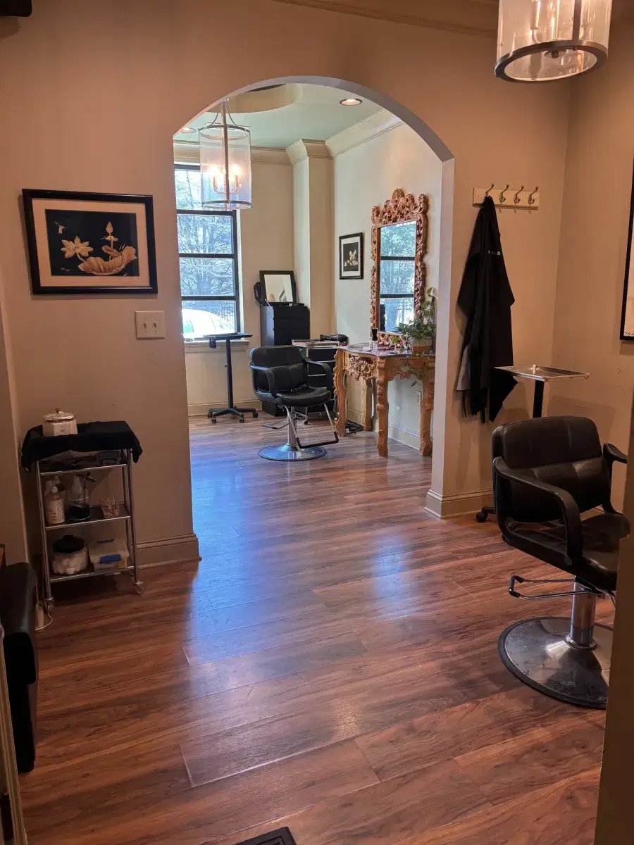 Elegant salon suite interior with large mirror